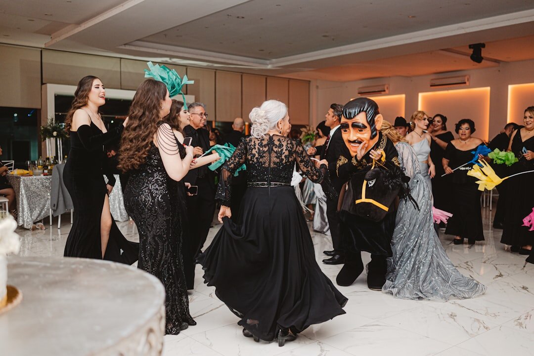 Group of well dressed guests mingling at a glamorous entertainment gala