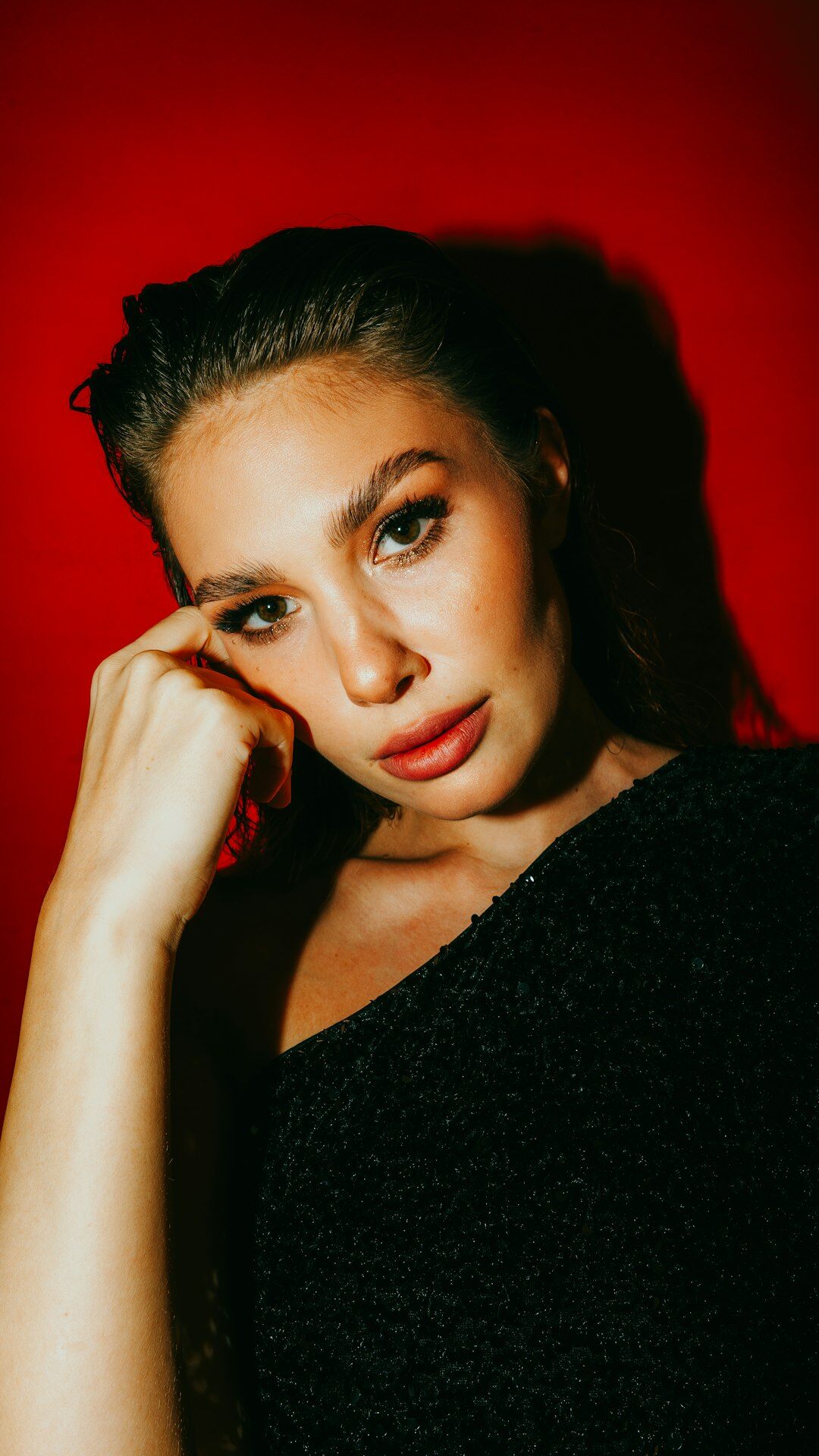 Studio portrait of a young Uruguayan female influencer smiling